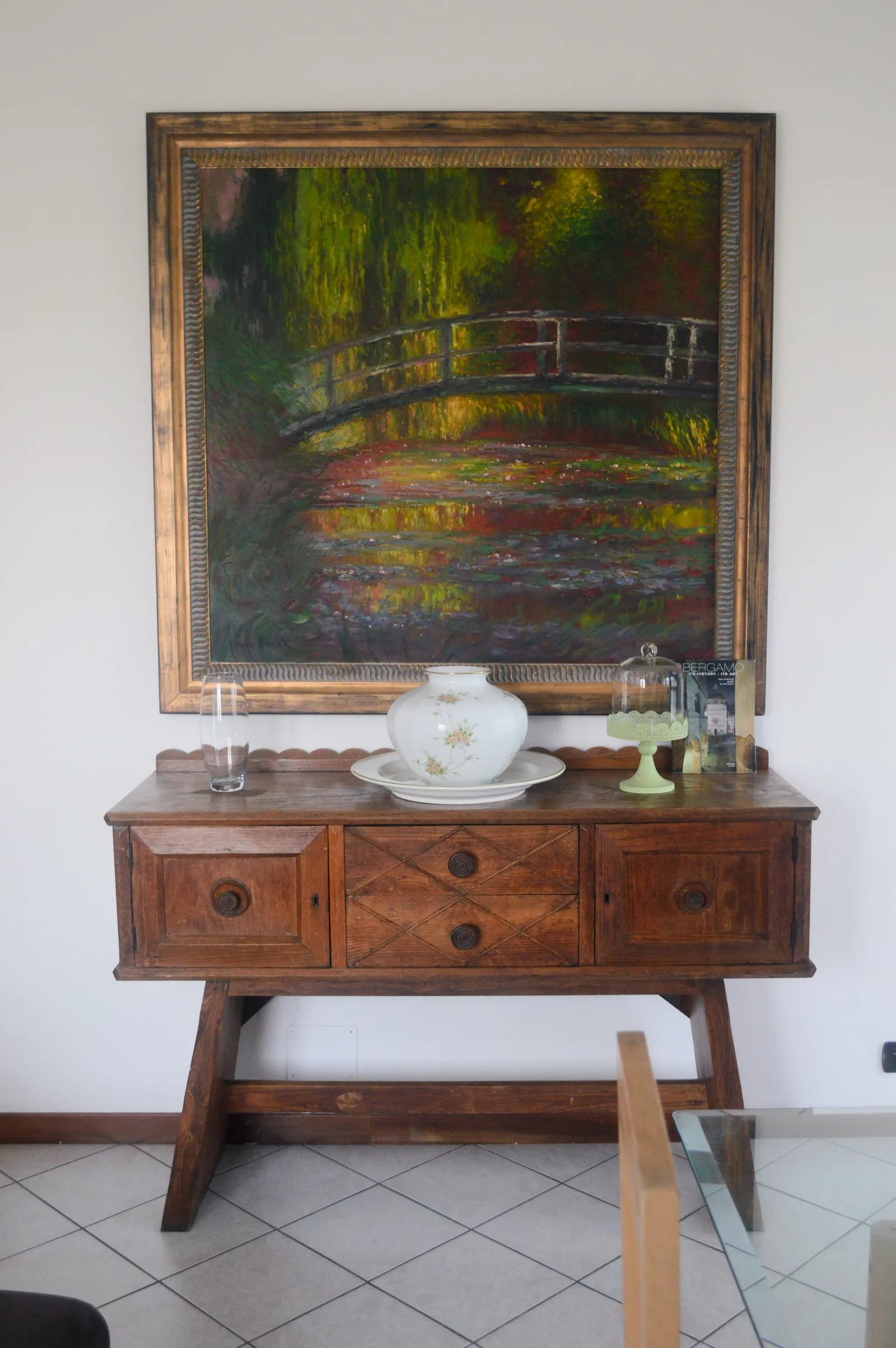 Wooden sideboard with Monet-style bridge painting
