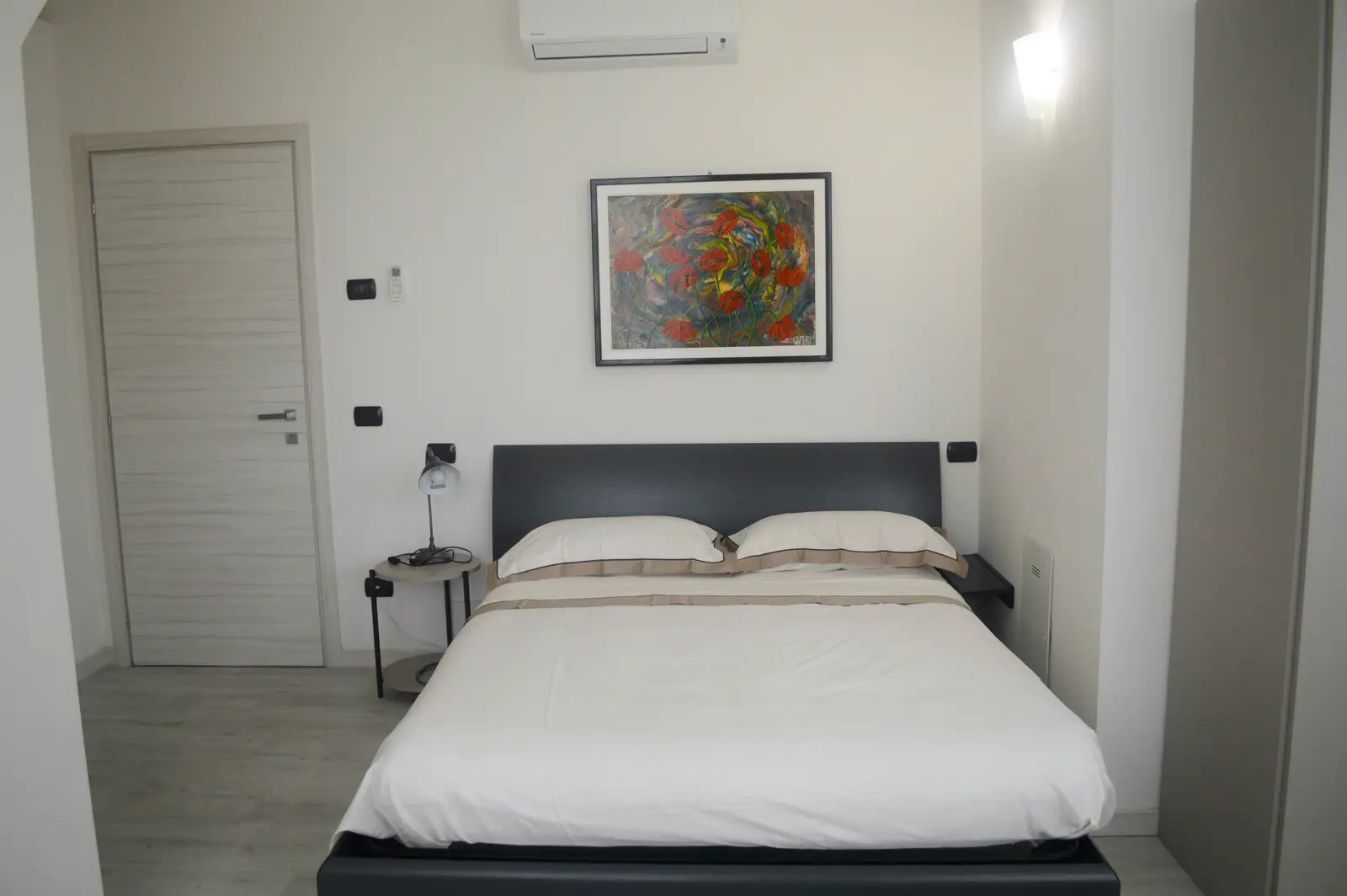 Suite bedroom with floral artwork