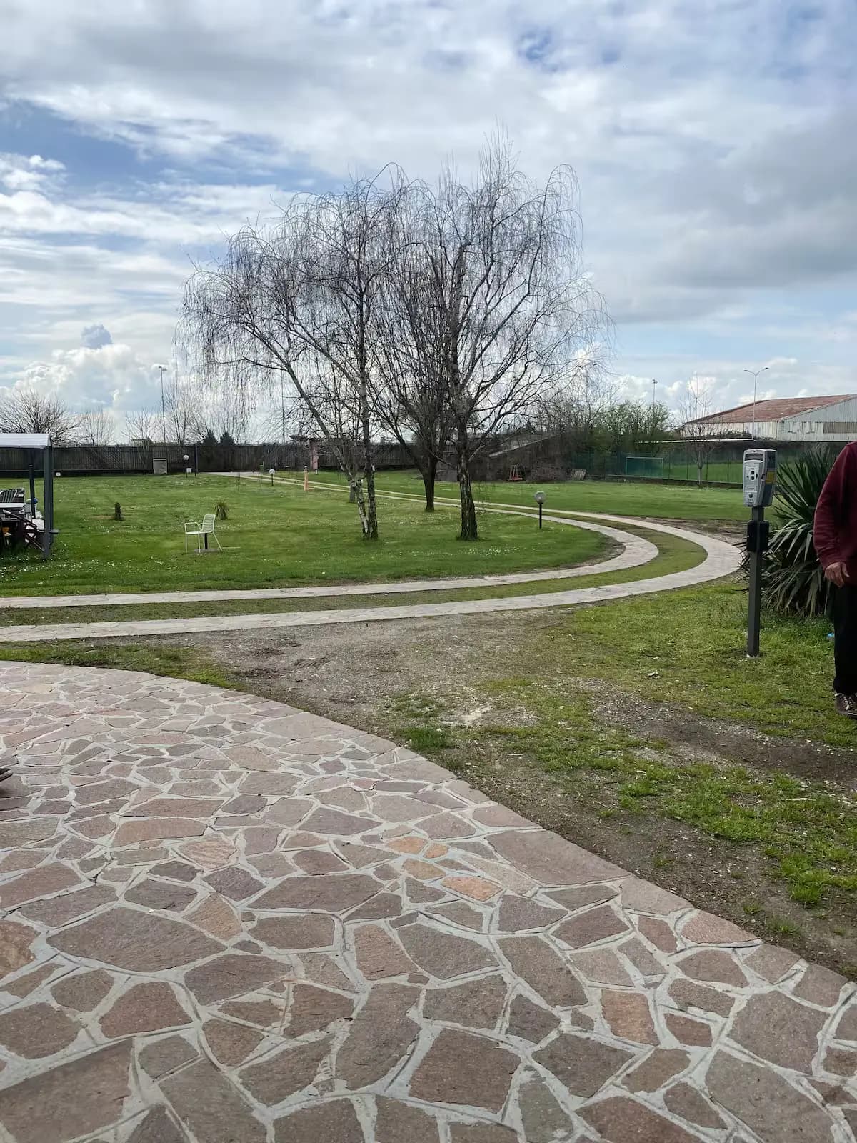 Curved stone pathway through the Villa Gabri grounds